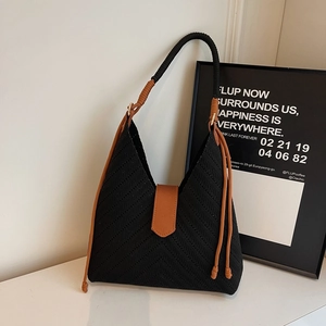 Large woven tote bag with black chevron pattern and brown rope handles for commuting