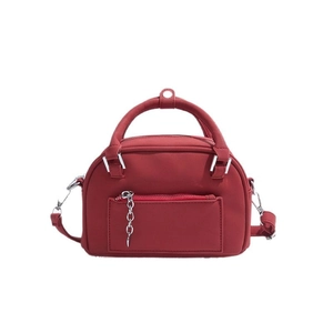Deep red Boston style mini handbag with matte leather texture and silver chain detail