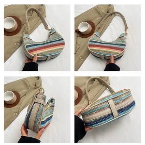 Detailed views of a rainbow striped straw crescent bag with a faux leather strap