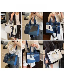 Detail view of denim patchwork tote bags in navy blue and white with adjustable straps