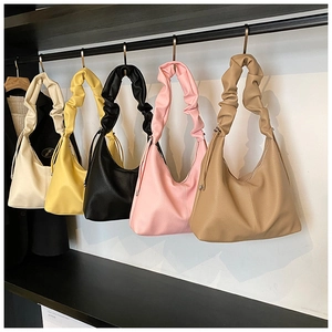 Hobo shoulder bags with ruffled straps in white, yellow, black, pink, and brown