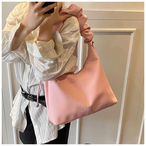 Pink lychee texture leather underarm bag with a stylish ruched cloud-style shoulder strap