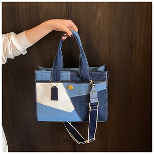 Fashionable denim patchwork tote bag with gold turnlock and wide shoulder strap