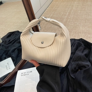 Chic pleated cream handbag with vertical accordion folds and sleek leather texture for women