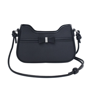 Minimalist black nylon shoulder bag with butterfly bow and silver buckle detail