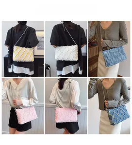 Quilted denim shoulder bag with frayed texture and chain strap in multiple colors