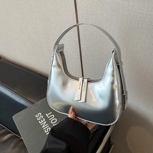 Chic silver metallic crescent hobo bag with a minimalist design and top handle