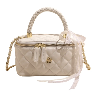 Elegant beige quilted vanity bag with woven handle and chain strap for women