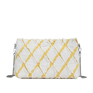 Chic yellow denim underarm bag with white quilted diamond pattern and silver chain strap