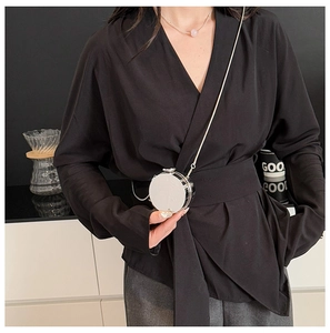 Mini silver round acrylic chain bag with a high-gloss mirror finish and metallic strap
