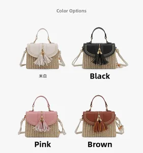 Detail view of woven straw handbags with leather flap and double tassel in four colors
