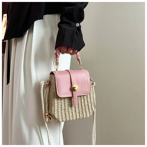Detail of pink PU flap and woven body mini crossbody bag with rope shoulder strap