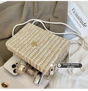 Detailed interior capacity showing space for smartphone and perfume in straw crossbody bag