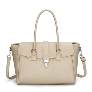 Beige pebble leather tote bag with silver metallic clasp and adjustable shoulder strap