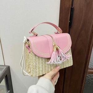 Handmade woven straw handbag with pink leather flap and fringe tassel shoulder strap