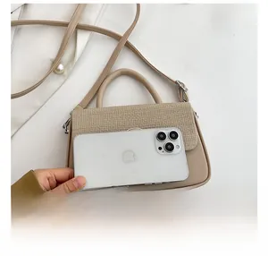 Detailed close-up of a beige flap bag with woven texture next to a smartphone for size scale