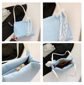 Detail view of denim tote bag with white lace bow and organized interior pockets