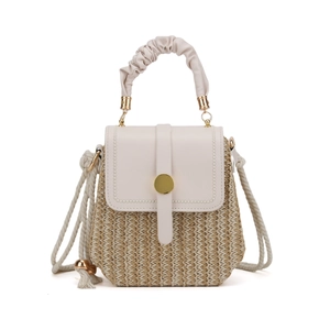 French style woven straw crossbody bag with cream leather flap and gold buckle detail