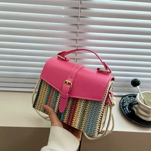Fashionable straw crossbody bag with colorful vertical stripes and rose red top handle