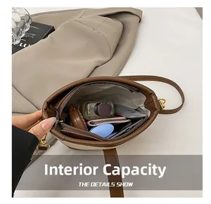 Interior view showing spacious capacity with a zipper pocket and daily essentials in the bag