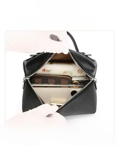 Internal view of black lychee leather bag showing spacious storage for a 9.7 inch iPad