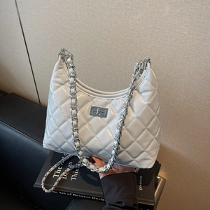 Chic white quilted crossbody bag with silver chain strap and metal lock closure