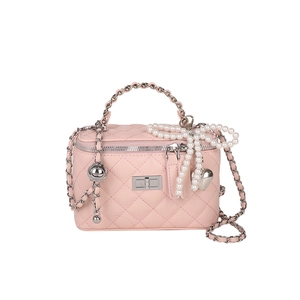 Pink quilted shoulder bag with silver chain handle and white pearl heart charm