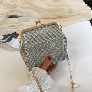Silver rhinestone evening clutch bag with pearl chain strap and gold hardware