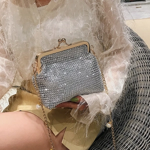 Elegant silver rhinestone evening bag with gold pearl chain and luxury crystal finish