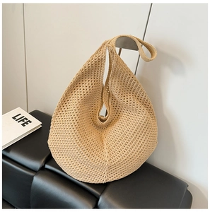 Minimalist straw woven tote bag with hollow design for beach vacations and summer leisure