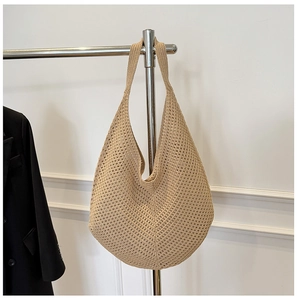 Detail of hand-woven cotton tote bag featuring a crochet hollow-out pattern and large capacity