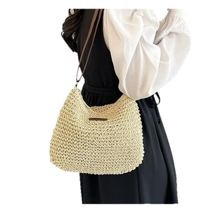 Minimalist cream woven straw bag with dark brown leather straps for summer casual wear