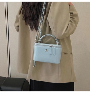 Mini light blue glossy crossbody box bag with silver flower hardware and chain strap