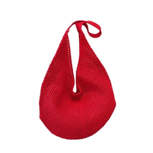 Minimalist red knitted hollow beach tote bag with a woven mesh texture for summer
