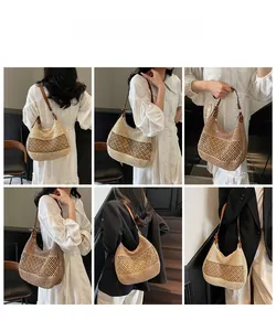 Detail der gewebten Stroh-Hobo-Tasche mit Netzstruktur und verstellbarem PU-Lederriemen