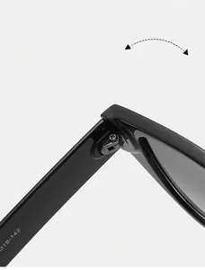 Detailed macro view of durable metal hinge on black small frame sunglasses