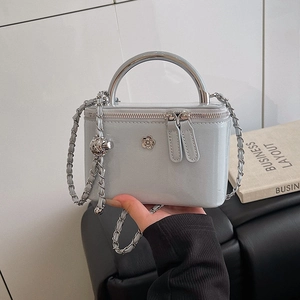Light grey patent leather chain crossbody box bag with silver flower clasp and handle