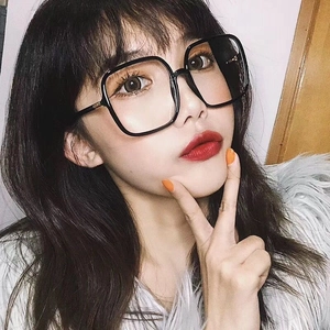 Close-up of stylish oversized black square glasses frame on female model for a slim face look