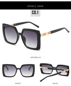 Detailsicht der quadratischen Sonnenbrille mit goldenem Metalldekor und Verlaufsgläsern