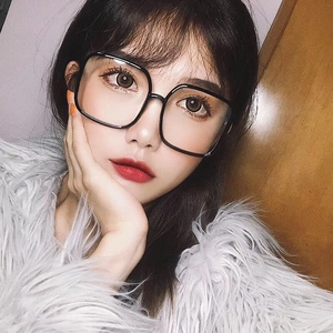 Close-up of stylish oversized black square frames on female model for a chic street look