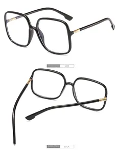 Detail view of black square frame glasses with golden metal hinges from side and back angles