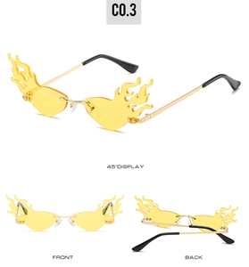 Détails macro de lunettes flamme sans monture avec verres jaunes et branches métalliques