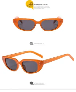 Vorder- und 45-Grad-Ansicht der Cat-Eye-Sonnenbrille mit orangefarbenem Rahmen und grauen Gläsern