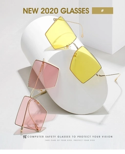 Detail of square gold metal frames with stylish yellow and pink gradient lenses