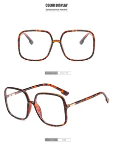 Detail view of square tortoiseshell blue light blocking glasses with gold metal hinges