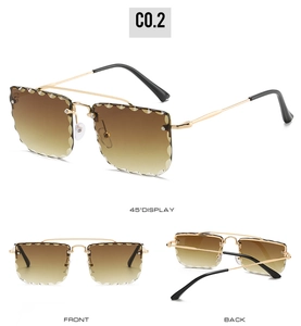 Detail view of rimless square sunglasses with gold metal double bridge and gradient lenses