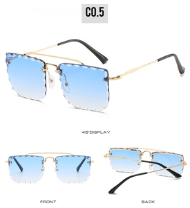 Detail of rimless blue gradient sunglasses with petal cut edges and gold metal temples