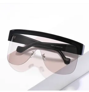 Close-up of model 19005 C1 printed specs on the temple of oversized gradient sunglasses