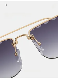 Close-up of comfortable silicone nose pads and metal bridge on rimless sunglasses
