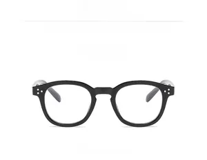 Détail d'une monture ronde vintage noir brillant avec verres anti-lumière bleue
